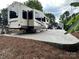 A recreational vehicle with foliage in the foreground at 104 Cardinal Dr, New London, NC 28127