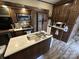 RV kitchen featuring island sink, cabinets, and modern appliances at 104 Cardinal Dr, New London, NC 28127