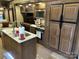 Shot of kitchen featuring stainless appliances, central island, stove and microwave at 104 Cardinal Dr, New London, NC 28127