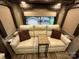 Cozy RV living room with comfortable seating, cushions, and decor at 104 Cardinal Dr, New London, NC 28127
