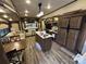 Wide angle view of the open living space with kitchen, dining and sitting areas at 104 Cardinal Dr, New London, NC 28127