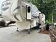 Spacious RV with a modern design and comfortable living space parked on a concrete pad at 104 Cardinal Dr, New London, NC 28127
