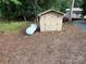 Small shed with double doors and propane tank at 104 Cardinal Dr, New London, NC 28127