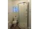 Cozy bathroom featuring a shower with glass doors and a compact toilet area at 1110 20Th Ne St, Hickory, NC 28601