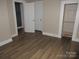Neutral-toned bedroom with laminate flooring and classic white doors and trim at 1110 20Th Ne St, Hickory, NC 28601