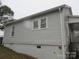 A home featuring vinyl siding, windows, and a partial basement at 1110 20Th Ne St, Hickory, NC 28601