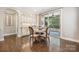 Cozy breakfast nook features a table with seating for four and access to the outdoor patio at 11412 Preservation Ln, Charlotte, NC 28278