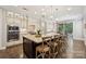 Spacious kitchen featuring an island with seating, modern appliances, and natural light at 11412 Preservation Ln, Charlotte, NC 28278