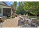 Paver patio with outdoor seating, a built in grill, and a screened in porch at 11412 Preservation Ln, Charlotte, NC 28278