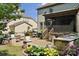 Outdoor patio with seating, a built in grill, and a screened in porch in a landscaped backyard at 11412 Preservation Ln, Charlotte, NC 28278