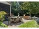 Paver patio with seating and a screened-in porch for relaxing outdoors at 11412 Preservation Ln, Charlotte, NC 28278