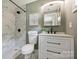 Updated bathroom with marble shower, modern vanity, and sleek black fixtures at 11539 Five Cedars Rd, Charlotte, NC 28226