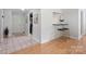 Bright entryway featuring tile floors and a seamless transition to hardwood flooring at 11539 Five Cedars Rd, Charlotte, NC 28226