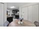 The kitchen boasts dark cabinetry, stainless appliances, and eat-in breakfast area at 11539 Five Cedars Rd, Charlotte, NC 28226