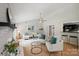 Open concept living room features neutral furniture, fireplace, and a passthrough to the kitchen at 11539 Five Cedars Rd, Charlotte, NC 28226