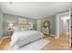 Cozy main bedroom with soft lighting, stylish decor, and hardwood flooring at 11539 Five Cedars Rd, Charlotte, NC 28226