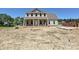 Two-story home with brick facade, white columns, complementary siding, and a covered front porch at 11543 Valley Oak Ln, Stanfield, NC 28163