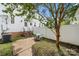 Private backyard features a patio, grass area, tree, and white fence with a seating area at 12342 Carrigan Ct, Huntersville, NC 28078