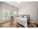 Comfortable bedroom with hardwood floors and plenty of natural light at 12342 Carrigan Ct, Huntersville, NC 28078