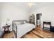 Bright bedroom with hardwood floors, ceiling fan and stylish furniture at 12342 Carrigan Ct, Huntersville, NC 28078