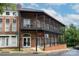 A red brick building with black metal railings and a restaurant sign at 12342 Carrigan Ct, Huntersville, NC 28078