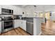 Well-maintained kitchen featuring stainless steel appliances and hardwood floors at 12342 Carrigan Ct, Huntersville, NC 28078