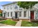 Beautiful townhome featuring a well-kept lawn and classic architectural details at 12342 Carrigan Ct, Huntersville, NC 28078