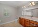 Bright bathroom features double sink vanity with a separate shower and tub at 124 Glade Valley Ave, Mooresville, NC 28117