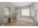 Primary bathroom features shower and separate tub at 124 Glade Valley Ave, Mooresville, NC 28117