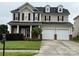 Charming two-story home with a well-manicured lawn and a two-car garage at 124 Glade Valley Ave, Mooresville, NC 28117