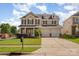Charming two-story home with a well-manicured lawn and a three-car garage at 124 Glade Valley Ave, Mooresville, NC 28117