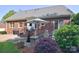 Backyard featuring a patio, an umbrella, and an elevated porch at 14232 Kendalton Meadow Dr, Mint Hill, NC 28227
