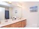 Bathroom features a dual vanity and a shower with an anchor themed curtain at 14232 Kendalton Meadow Dr, Mint Hill, NC 28227