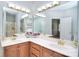 Bathroom features a dual vanity, large mirror, and tub shower combo at 14232 Kendalton Meadow Dr, Mint Hill, NC 28227
