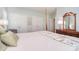 Comfortable bedroom with a four post bed, wood furniture, and lots of closet space at 14232 Kendalton Meadow Dr, Mint Hill, NC 28227