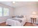 Bedroom with wood floor, neutral paint, and a big window at 14232 Kendalton Meadow Dr, Mint Hill, NC 28227