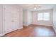 Bedroom features hardwood floors, double closets, and a ceiling fan at 14232 Kendalton Meadow Dr, Mint Hill, NC 28227