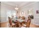 Formal dining room with hardwood floors, lots of natural light, and stylish chandelier at 14232 Kendalton Meadow Dr, Mint Hill, NC 28227