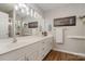 Bathroom featuring double sinks, a large mirror, wood floors, and recessed lighting at 1610 Union Rd # 1610B, Gastonia, NC 28054