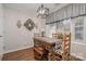 Charming dining room with hardwood floors, elegant light fixture, and black and white accents at 1610 Union Rd # 1610B, Gastonia, NC 28054