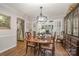 Formal dining room boasts hardwood floors, stylish light fixture, and seamless flow to the kitchen at 1610 Union Rd # 1610B, Gastonia, NC 28054