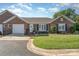Charming brick home with a manicured lawn, attached garage, and inviting front entrance at 1610 Union Rd # 1610B, Gastonia, NC 28054