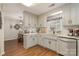 Well-lit kitchen featuring modern white cabinets, stainless steel appliances, and hardwood flooring at 1610 Union Rd # 1610B, Gastonia, NC 28054