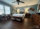 Comfortable main bedroom boasts ample space, natural light, hardwood floors, and decorative accents at 1610 Union Rd # 1610B, Gastonia, NC 28054