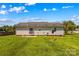 Backyard featuring grassy area and concrete patio at 189 Lochshire Ln, Woodleaf, NC 27054