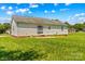 Picture of the backyard including a large grassy area at 189 Lochshire Ln, Woodleaf, NC 27054