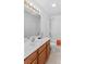 Bathroom with a light wood vanity, ample mirror and a shower-tub combination at 189 Lochshire Ln, Woodleaf, NC 27054