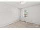 Inviting bedroom with carpet flooring and large window for natural light at 189 Lochshire Ln, Woodleaf, NC 27054