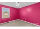 Bedroom with ceiling fan and bright pink walls, along with a window for natural light at 189 Lochshire Ln, Woodleaf, NC 27054
