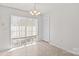 Bright dining area has natural light and a chandelier at 189 Lochshire Ln, Woodleaf, NC 27054